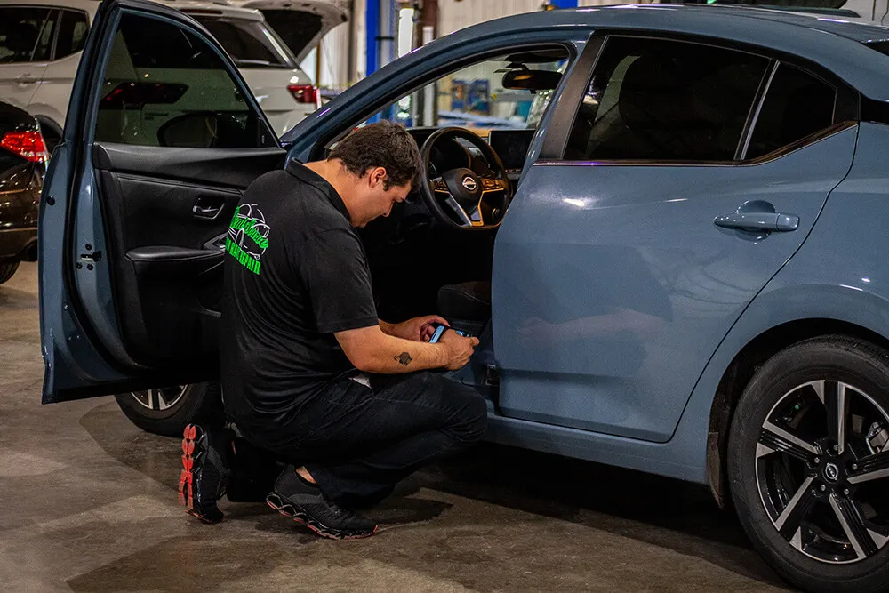 Staff inspecting vehicle