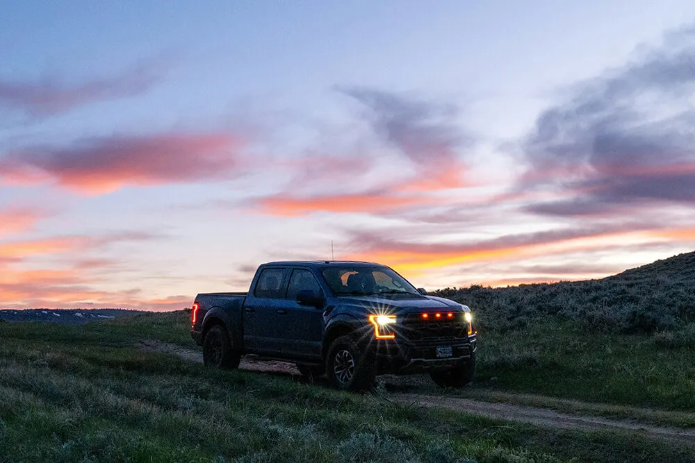 Truck driving at sunset