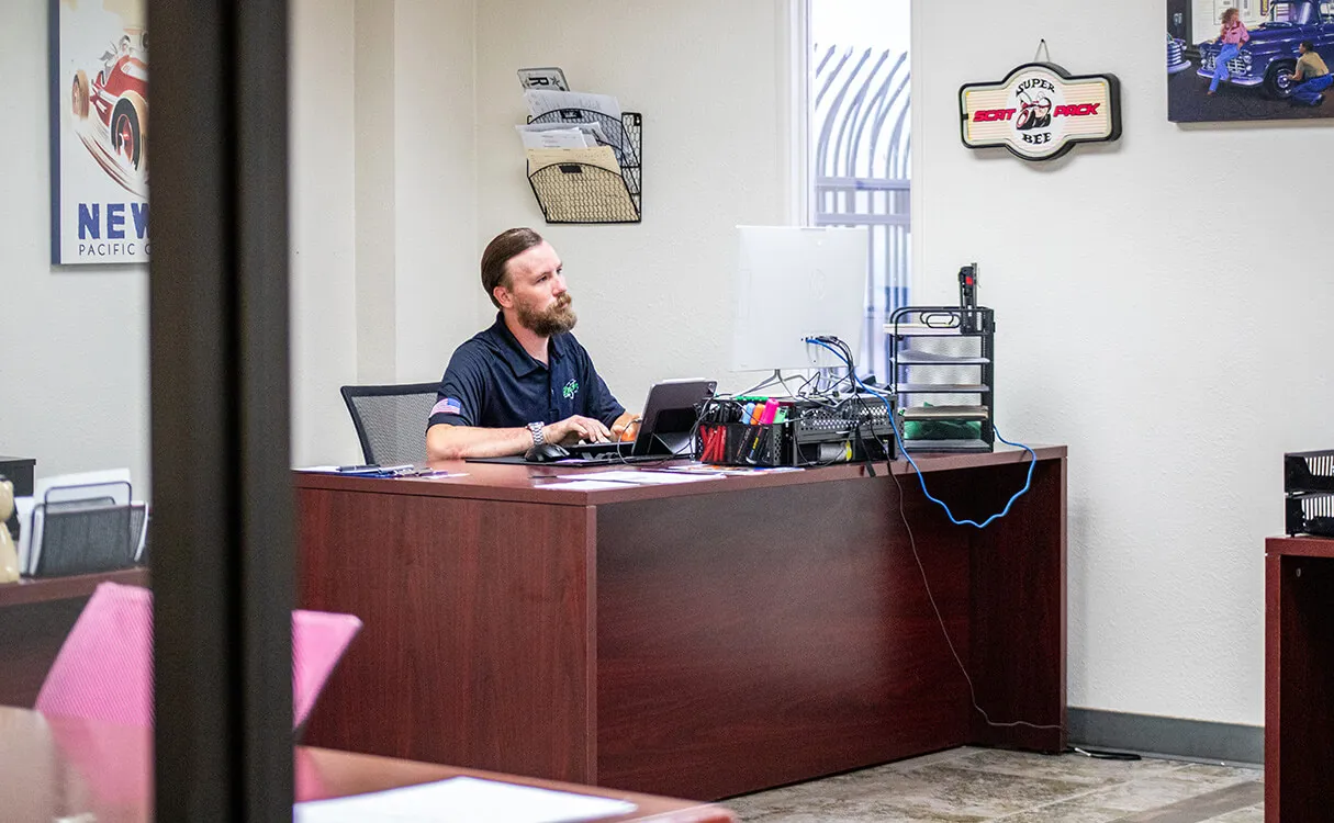 Team member at desk preparing quote